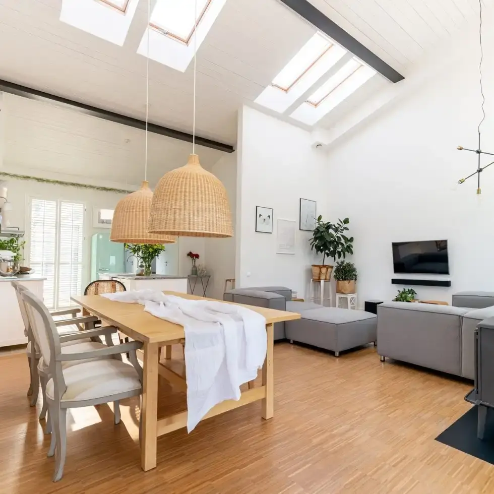 Bright open-concept apartment living and dining space managed by BMS Apartment Management for superior tenant experience